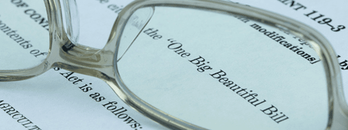 Reading glasses on legal paper